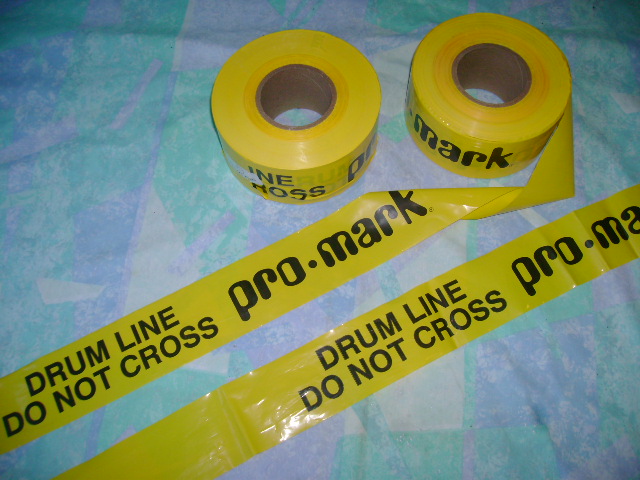 [IMAGE: drum line do not cross barricade tape]